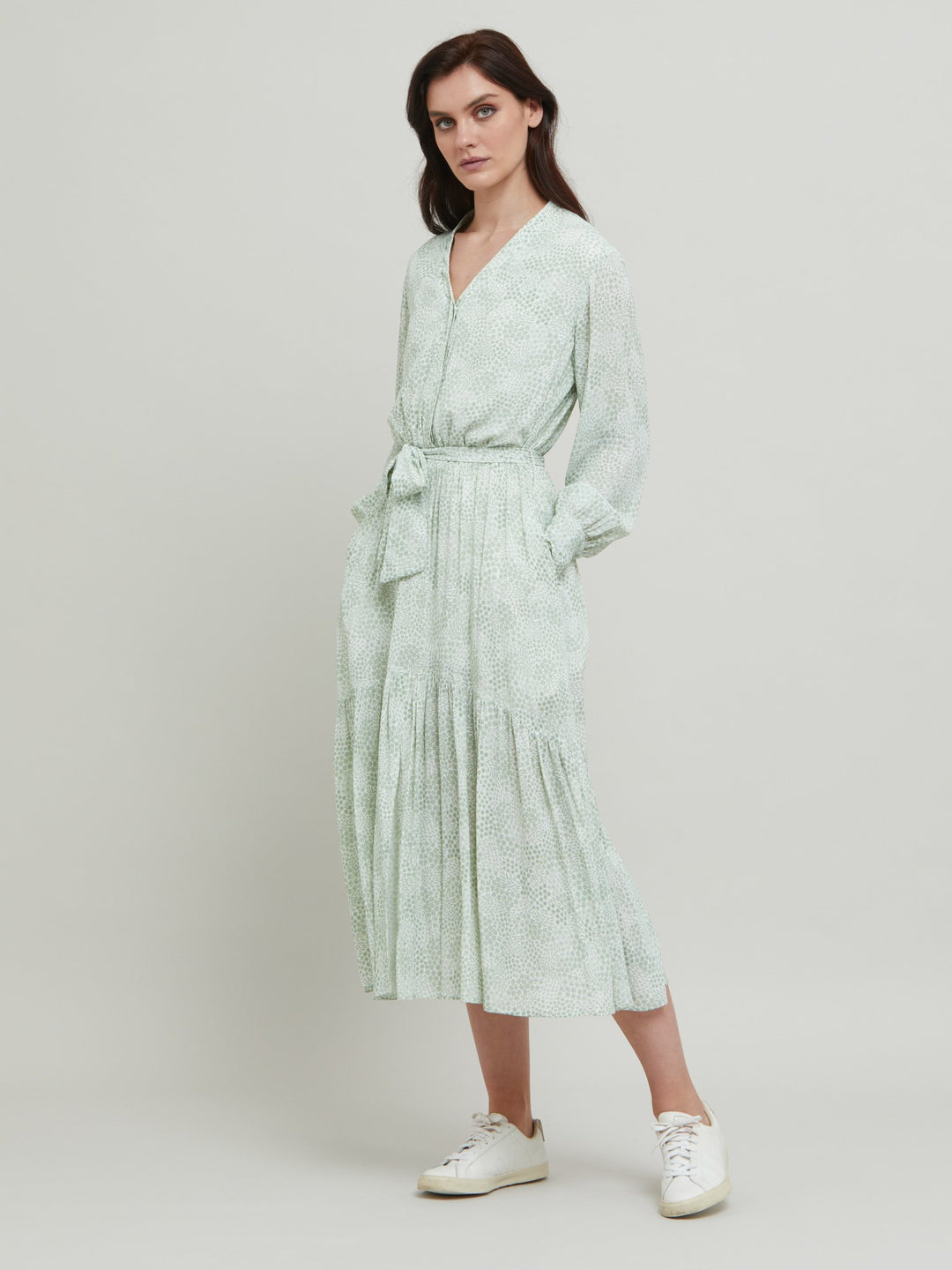 Meet the Martha Dress, a vintage bi-color mini floral in viscose crepe. A softly elasticated waist with a detachable belt, long-sleeved and flattering fluid bohemian tiered skirt with center front slit & V-neck. Relaxed elegance for everyday life.