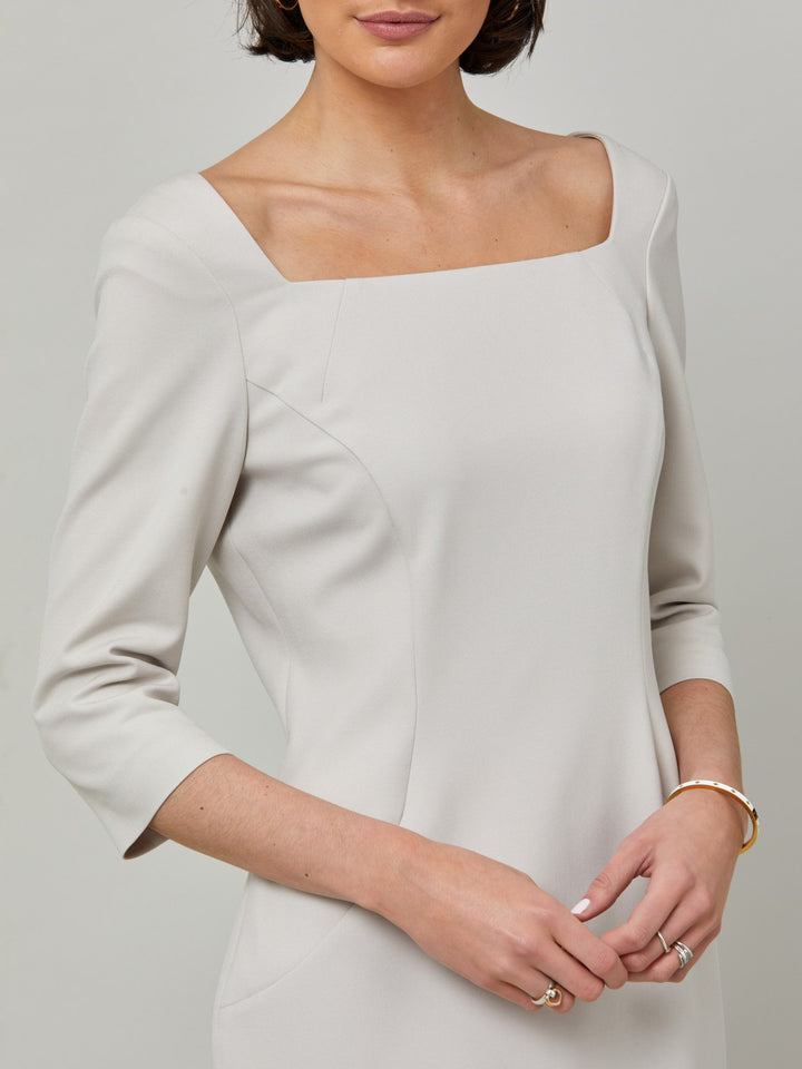 Introducing Mia, a body-skimming dress in a sophisticated latte. The dress features a flattering square neck and falls to a demure finish below the knee. Simple and refined elegance at its best. Attending a summer wedding? Mother of the bride? Heading to the races? This is the dress for you.