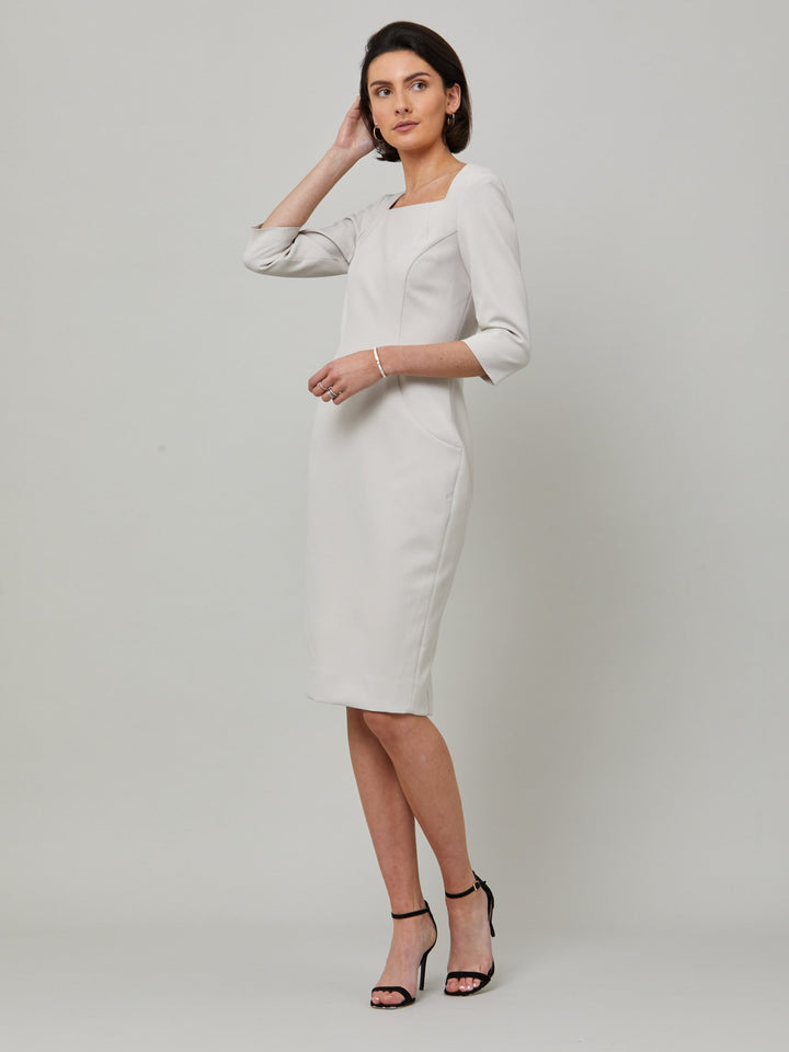 Introducing Mia, a body-skimming dress in a sophisticated latte. The dress features a flattering square neck and falls to a demure finish below the knee. Simple and refined elegance at its best. Attending a summer wedding? Mother of the bride? Heading to the races? This is the dress for you.