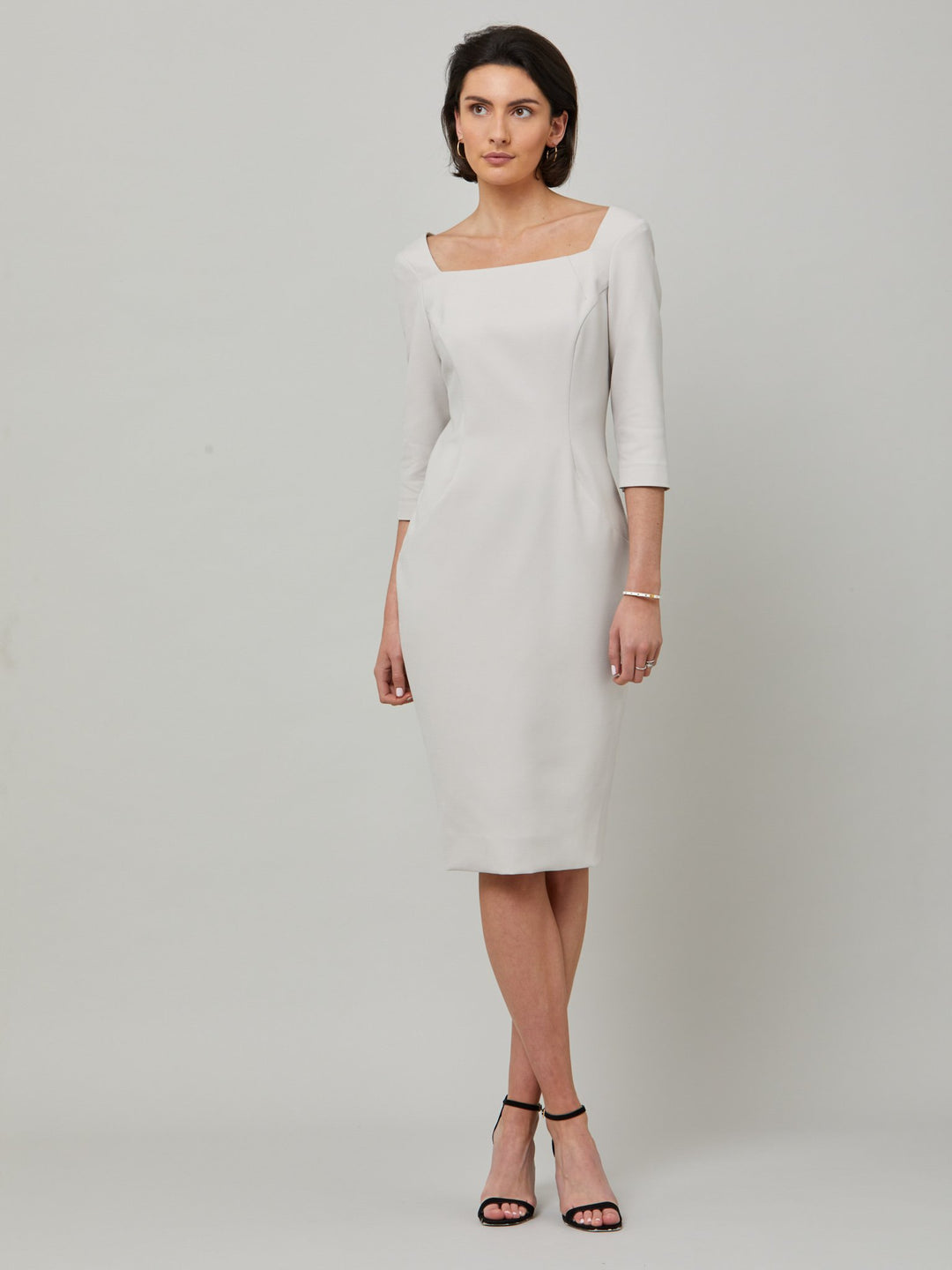 Introducing Mia, a body-skimming dress in a sophisticated latte. The dress features a flattering square neck and falls to a demure finish below the knee. Simple and refined elegance at its best. Attending a summer wedding? Mother of the bride? Heading to the races? This is the dress for you.