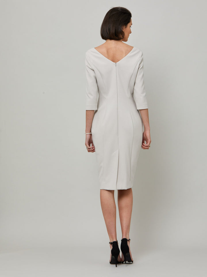 Introducing Mia, a body-skimming dress in a sophisticated latte. The dress features a flattering square neck and falls to a demure finish below the knee. Simple and refined elegance at its best. Attending a summer wedding? Mother of the bride? Heading to the races? This is the dress for you.