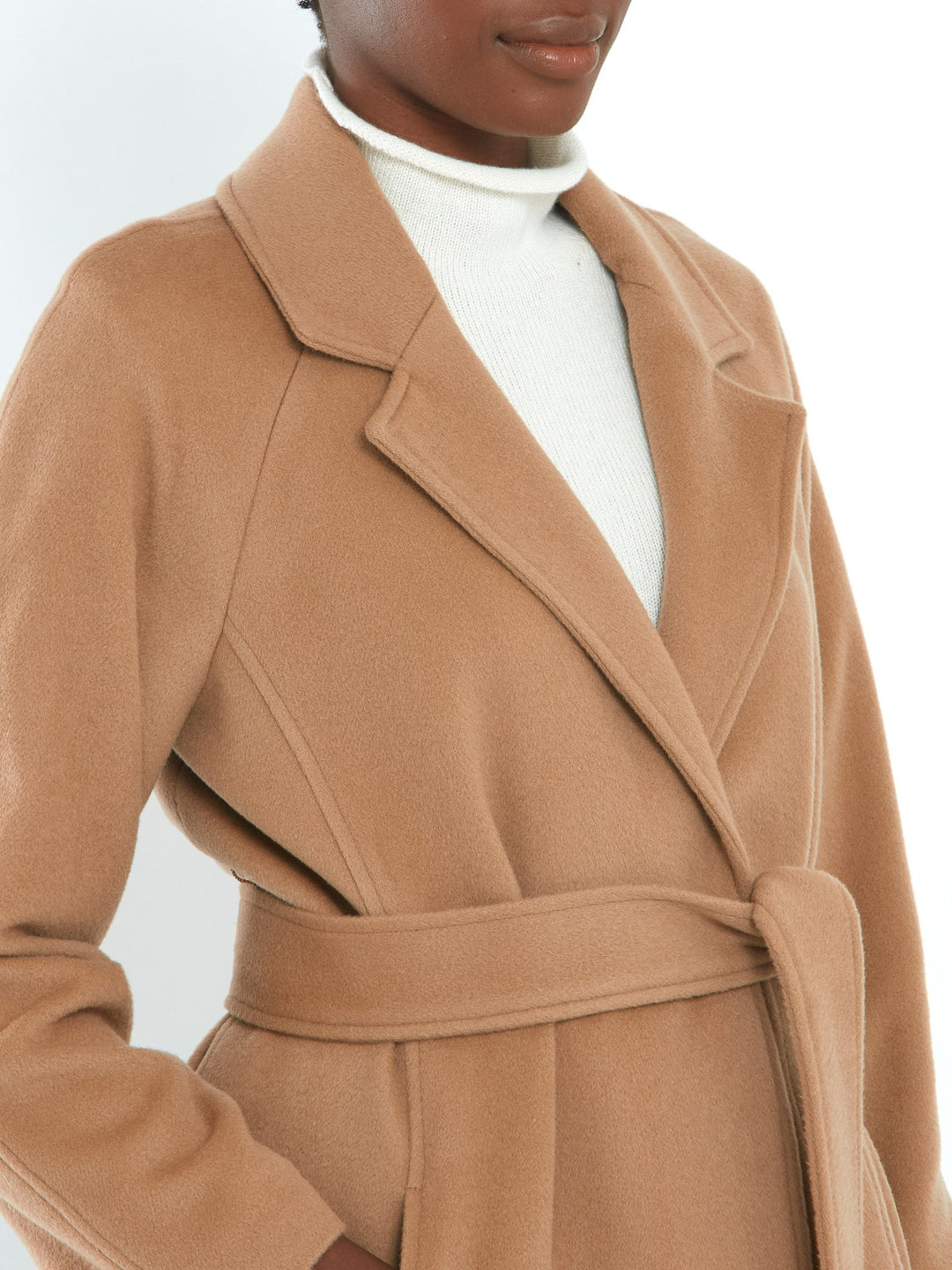 Camel Cashmere blend coat. A long relaxed silhouette with pockets & a detachable belt