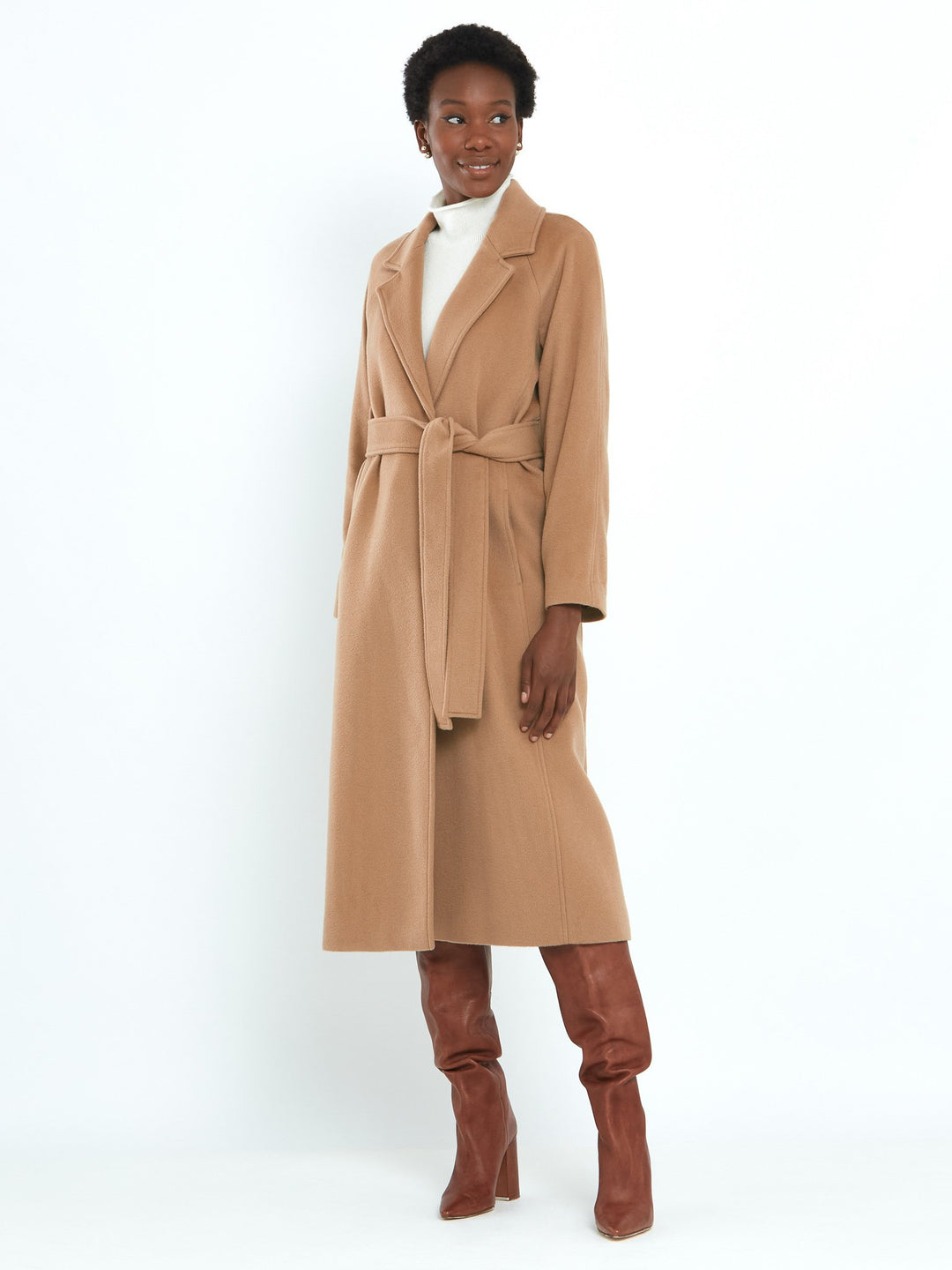 Camel Cashmere blend coat. A long relaxed silhouette with pockets & a detachable belt