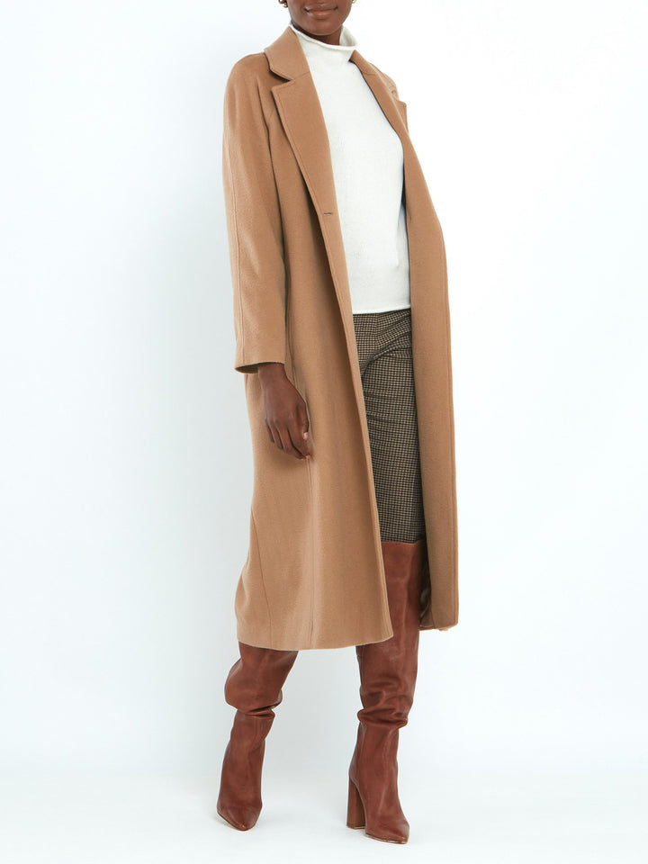 Camel Cashmere blend coat. A long relaxed silhouette with pockets & a detachable belt