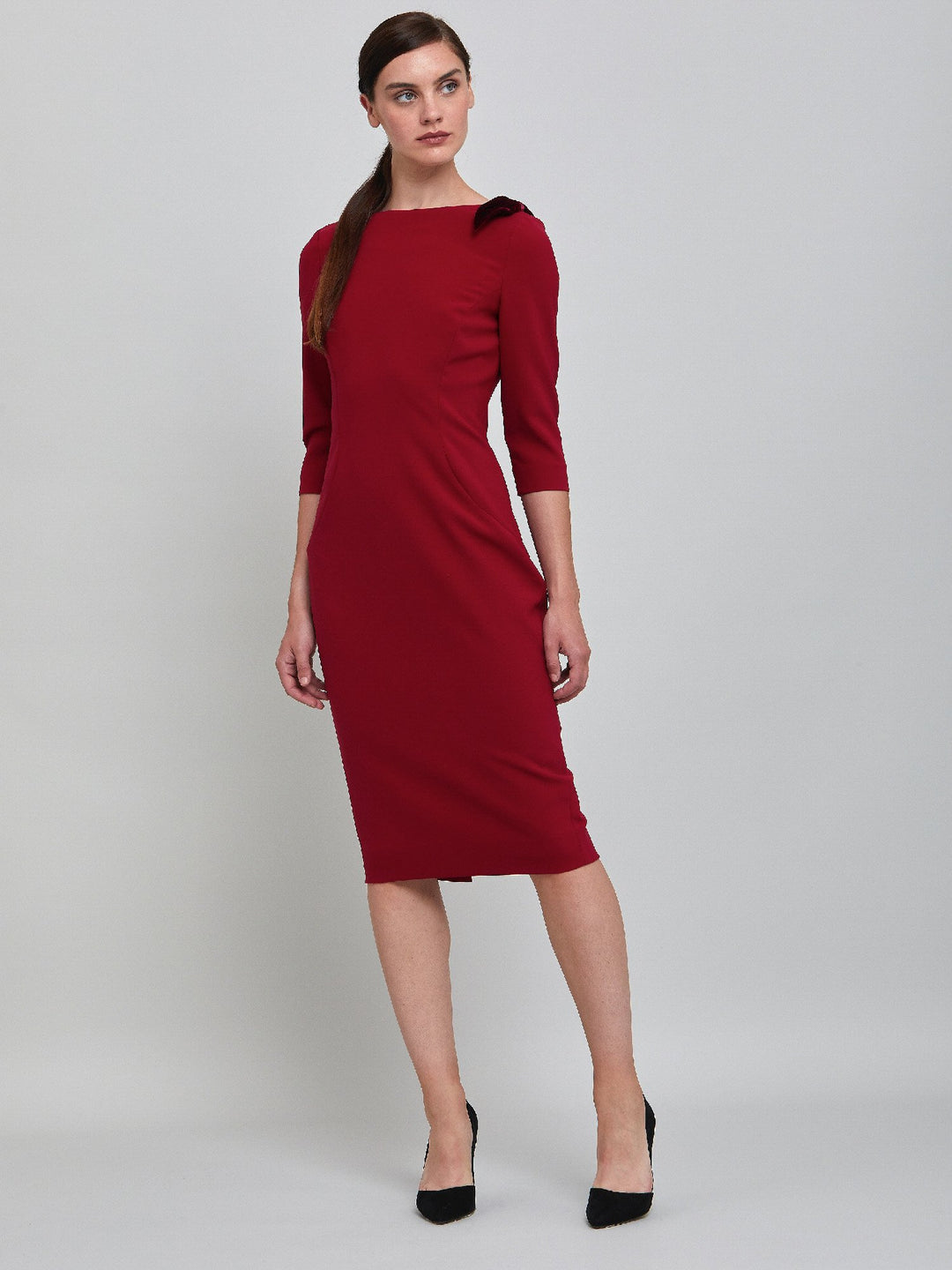 Natara, the perfect occasion dress. Crafted in a tricotine fabric with a hint of stretch. A body-skimming silhouette with slash neck, velvet bow detail and a pencil skirt the dress falls to mid-calf. Wear her out to cocktails with the girls, date night or a special winter wedding!