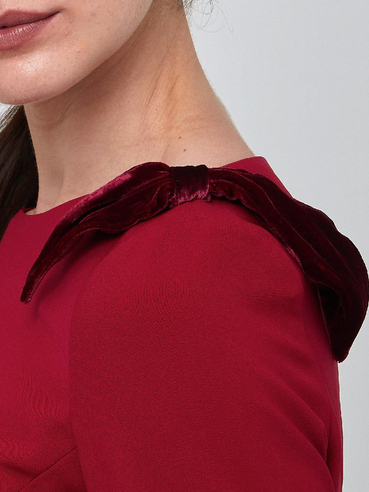 Natara, the perfect occasion dress. Crafted in a tricotine fabric with a hint of stretch. A body-skimming silhouette with slash neck, velvet bow detail and a pencil skirt the dress falls to mid-calf. Wear her out to cocktails with the girls, date night or a special winter wedding!