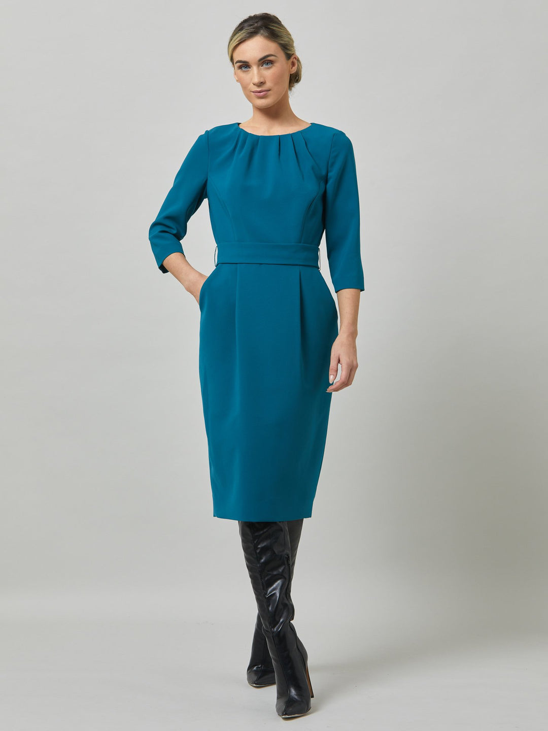 Nina is a fresh take on one of our key silhouettes. Note the softly pleated neckline and the elegant silhouette which hugs the frame around the hips and thighs for a flattering wear. Skirt falls to below the knee, fitted to the waist with handy pockets and detachable belt. Crafted in our signature crepe with a hint of stretch in atlantic teal. the perfect desk to dinner dress.