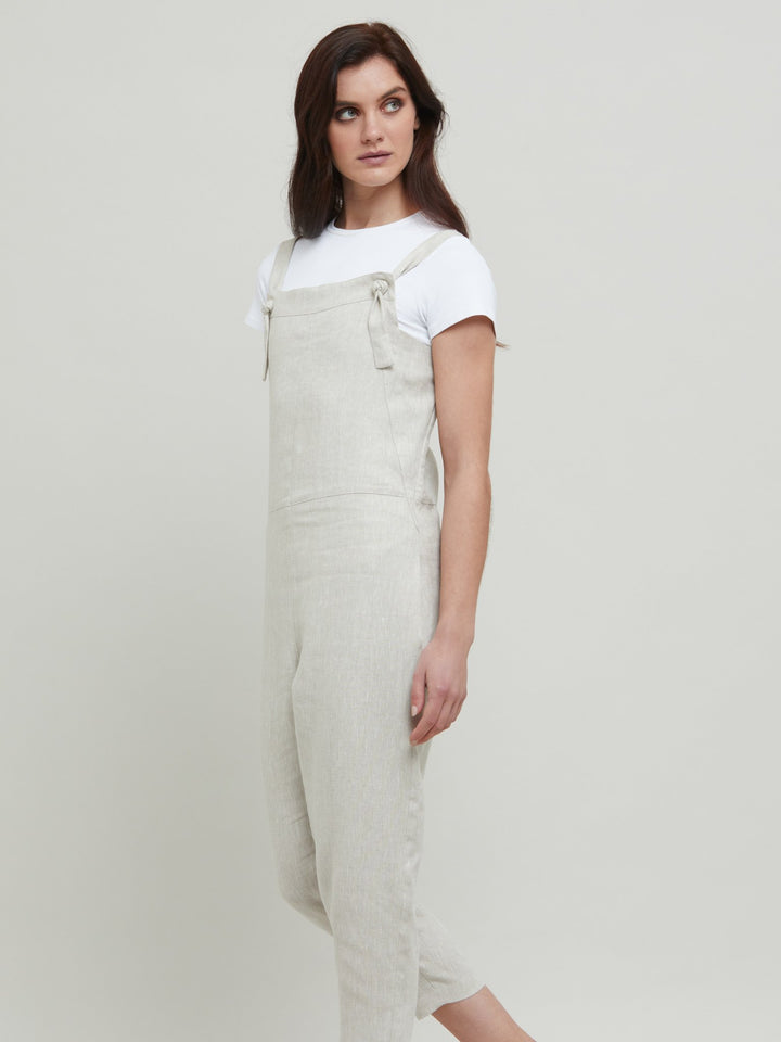 Introducing the Oakley Overalls. Sunny summer day & holiday lunches...this one-piece has you covered. A must-have pull-on linen jumpsuit in a fresh oatmeal tone. Style with our iconic white timeless tops for a fresh and easy look.