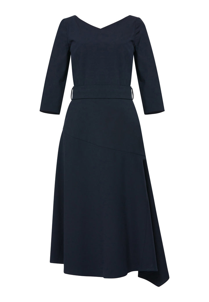 Step into elegance with the Odell Dark Navy Dress, a beautifully tailored and timeless piece. This dress features a detachable belt, fit and flare skirt, and an asymmetrical dipped hem. The wide V-neckline adds sophistication, while the hint of stretch ensures comfort and ease of movement. Whether you're attending a wedding, playing the role of the mother of the bride, or heading to the races, the Odell Dark Navy Dress is the perfect choice for a memorable occasion.