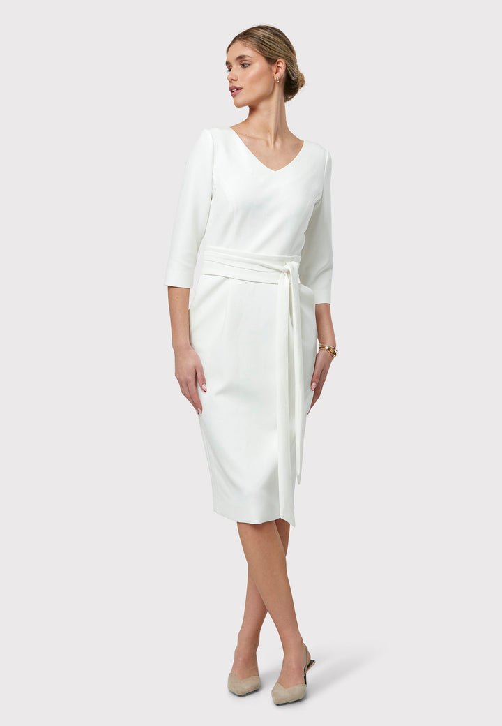 Meet Ophelia, a figure-flattering dress with pockets, a detachable belt, and a mid-calf pencil skirt. The refined V-neckline adds an elegant touch to this piece. Crafted from our signature tricotine with a hint of stretch for comfort and movement, it's perfect on its own or paired with the matching Obi belt. Ophelia is your go-to dress for summer events or race day elegance.