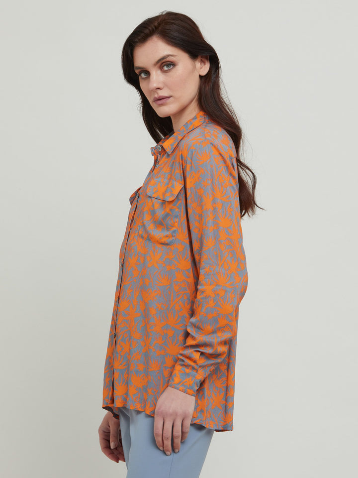 A classic shirt crafted in breathable viscose . This lux staple with flap pockets, back yoke & center back box pleat. An easy-fit shirt to elevate your everyday. Crafted in an adventurous and sophisticated rust & smoky blue print. Designed in Ireland by Helen McAlinden. Made in Europe. Free shipping to the EU & UK.