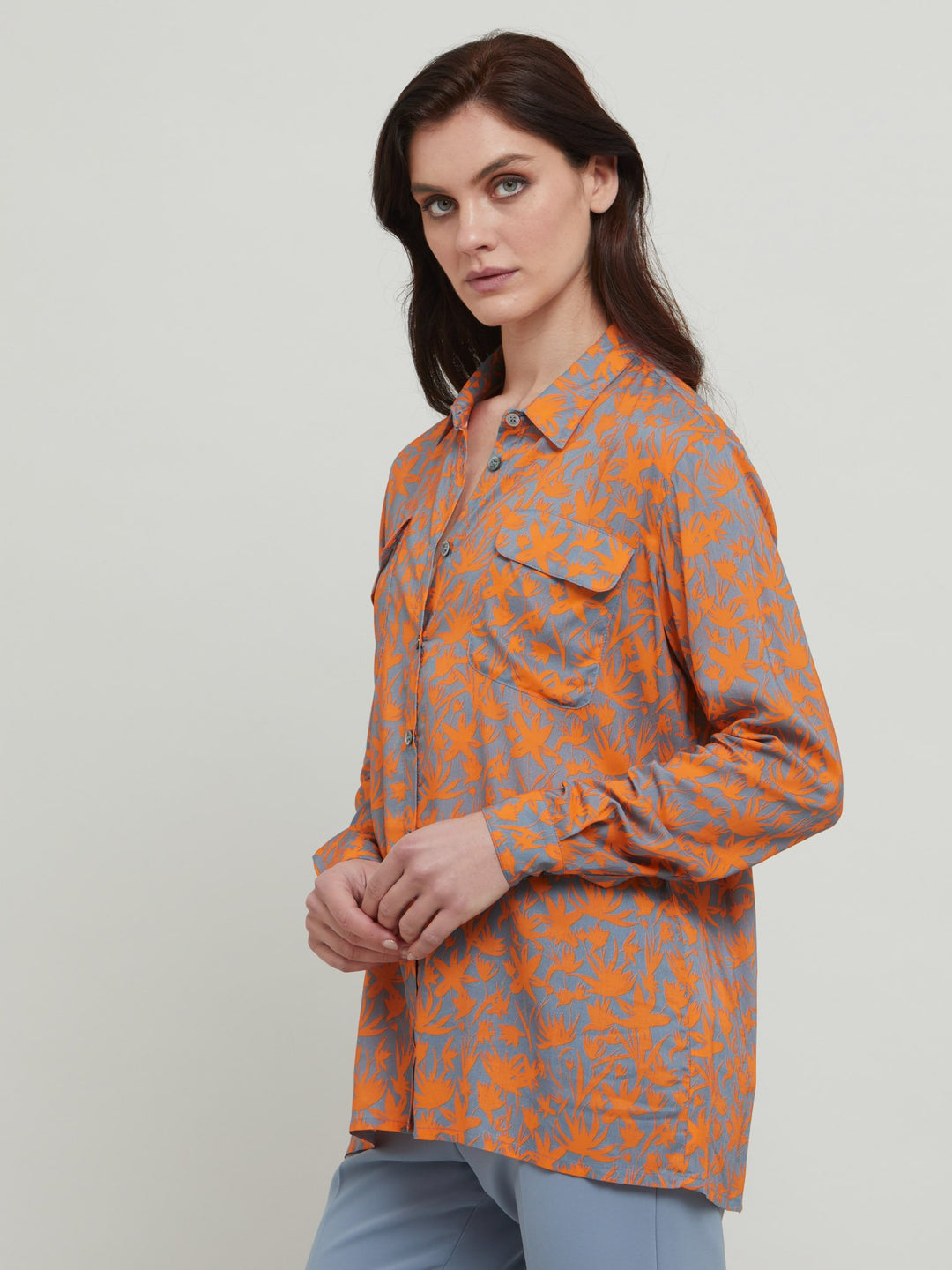 A classic shirt crafted in breathable viscose . This lux staple with flap pockets, back yoke & center back box pleat. An easy-fit shirt to elevate your everyday. Crafted in an adventurous and sophisticated rust & smoky blue print. Designed in Ireland by Helen McAlinden. Made in Europe. Free shipping to the EU & UK.