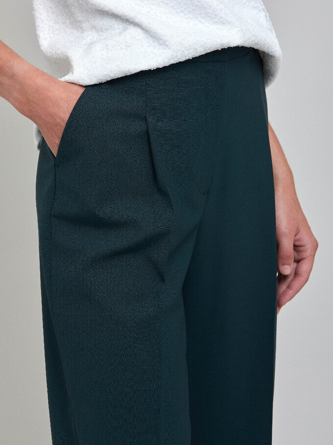 Investment-worthy, neat narrow-leg woolen trousers with a hint of stretch. A wardrobe staple and HMcA classic. This signature fabric is made from sustainability sourced fibers with a hint of elastane to ensure comfort and ease of movement.