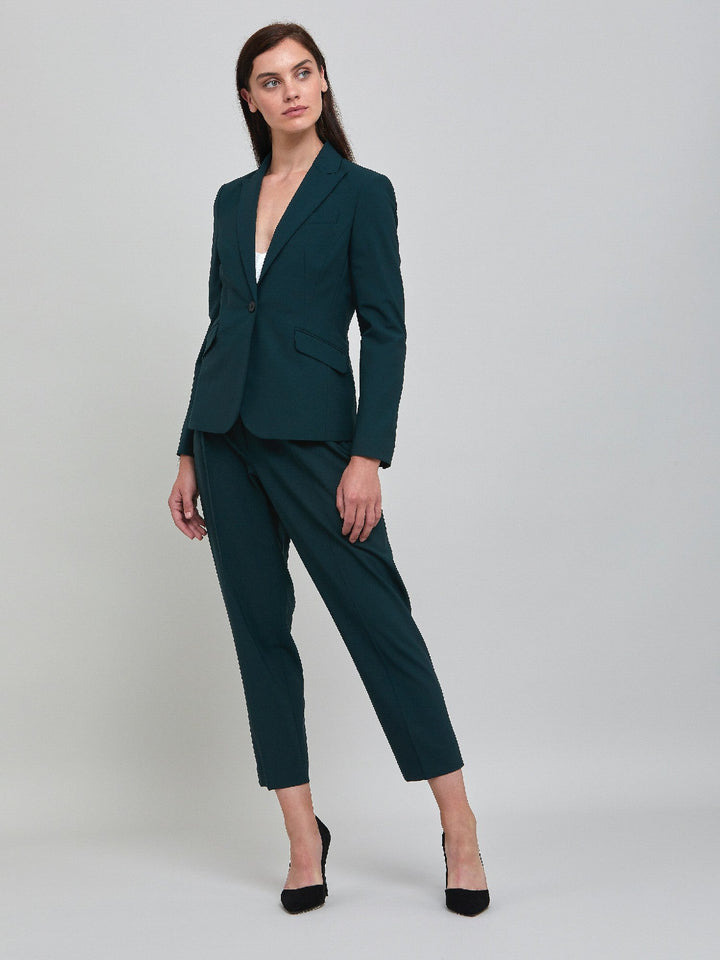 Investment-worthy, neat narrow-leg woolen trousers with a hint of stretch. A wardrobe staple and HMcA classic. This signature fabric is made from sustainability sourced fibers with a hint of elastane to ensure comfort and ease of movement.