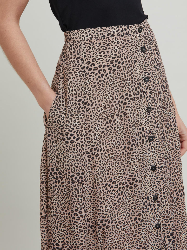 The essential transeasonal skirt. Meet Sadie, a classic animal print skirt in viscose crepe. Off centered button through A-line silhouette with an elasticated back waist band. Relaxed elegance for everyday life. Style with our black timeless tops or dress it down with the Khloe oatmeal sweatshirt.