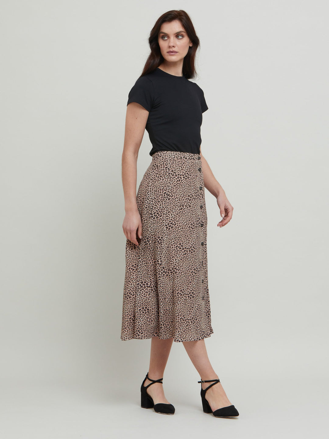 The essential transeasonal skirt. Meet Sadie, a classic animal print skirt in viscose crepe. Off centered button through A-line silhouette with an elasticated back waist band. Relaxed elegance for everyday life. Style with our black timeless tops or dress it down with the Khloe oatmeal sweatshirt.