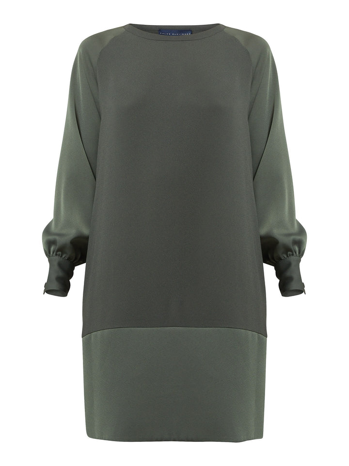 Introducing Sarah, a chic and effortlessly stylish shift dress that brings a fresh perspective to occasion wear. Crafted from luxurious olive satin back crepe, it offers a simple and easy-fit silhouette. The satin raglan sleeves add a touch of sophistication, while the deep satin band at the hem enhances the overall elegance. With convenient side seam pockets, Sarah provides both comfort and functionality. Embrace the versatility and timeless appeal of this dress, perfect for various occasions.