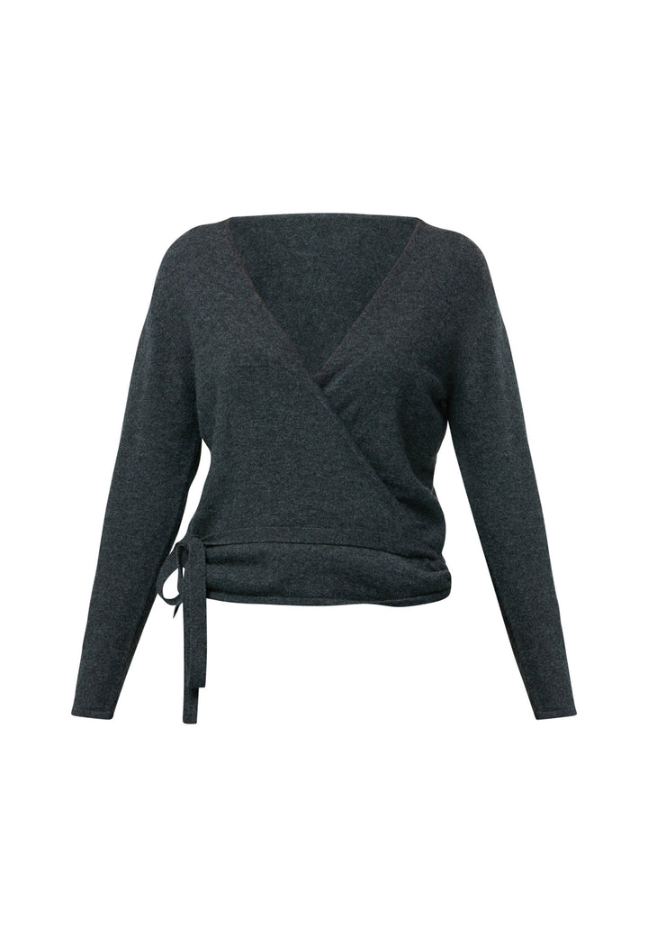 The Siena Grey Cashmere Ballet Wrap is a versatile cardigan designed with a true wrap style. It features full-length sleeves and offers multiple styling options. You can wear it to the front with a V-neckline or to the back with a high neckline and a V-back detail. Made from luxurious cashmere, this wrap can also be layered over the matching Mariena Sleeveless Top for a coordinated and chic ensemble. Embrace the versatility and timeless elegance of the Ballet Wrap.