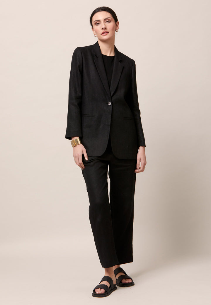 Choose the Vanessa black pant. A loose-fitting, pull-on linen pant that embraces laid-back spirit. A piece you can't travel without. Designed to sit on the high waist for a flattering fit. Features an elasticated waistband. Pair it with a simple tee and the co-ordinating Cassie boyfriend-blazer with trainers for a chic and contemporary look.