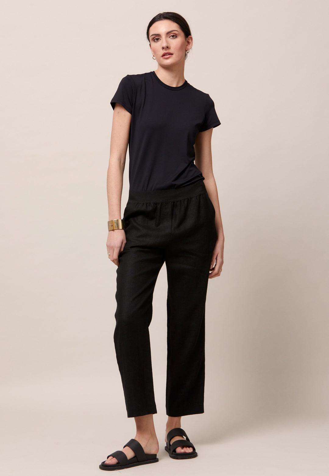 Choose the Vanessa black pant. A loose-fitting, pull-on linen pant that embraces laid-back spirit. A piece you can't travel without. Designed to sit on the high waist for a flattering fit. Features an elasticated waistband. Pair it with a simple tee and the co-ordinating Cassie boyfriend-blazer with trainers for a chic and contemporary look.