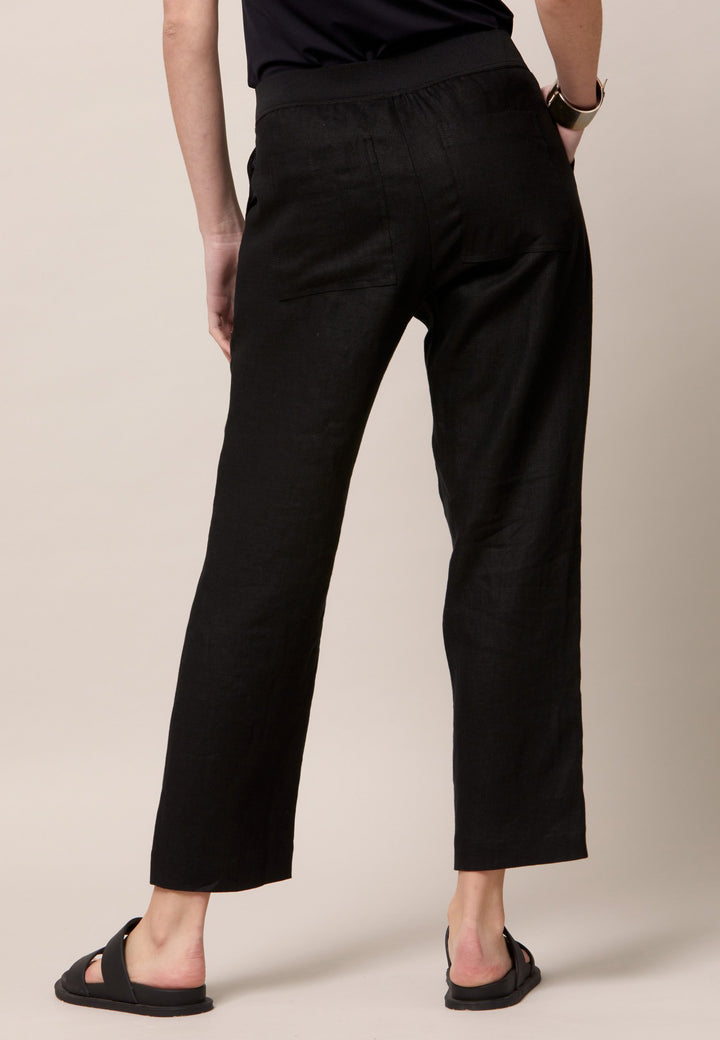 Choose the Vanessa black pant. A loose-fitting, pull-on linen pant that embraces laid-back spirit. A piece you can't travel without. Designed to sit on the high waist for a flattering fit. Features an elasticated waistband. Pair it with a simple tee and the co-ordinating Cassie boyfriend-blazer with trainers for a chic and contemporary look.