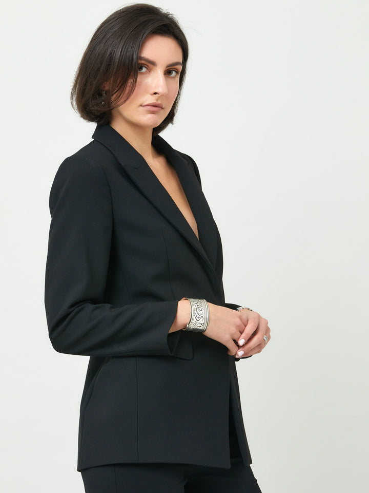 Willow, redefining the blazer. This modern blazer features a classic collar and rever, semi-fitted silhouette cut from timeless black double crepe with a hint of stretch to give a sense of ease.