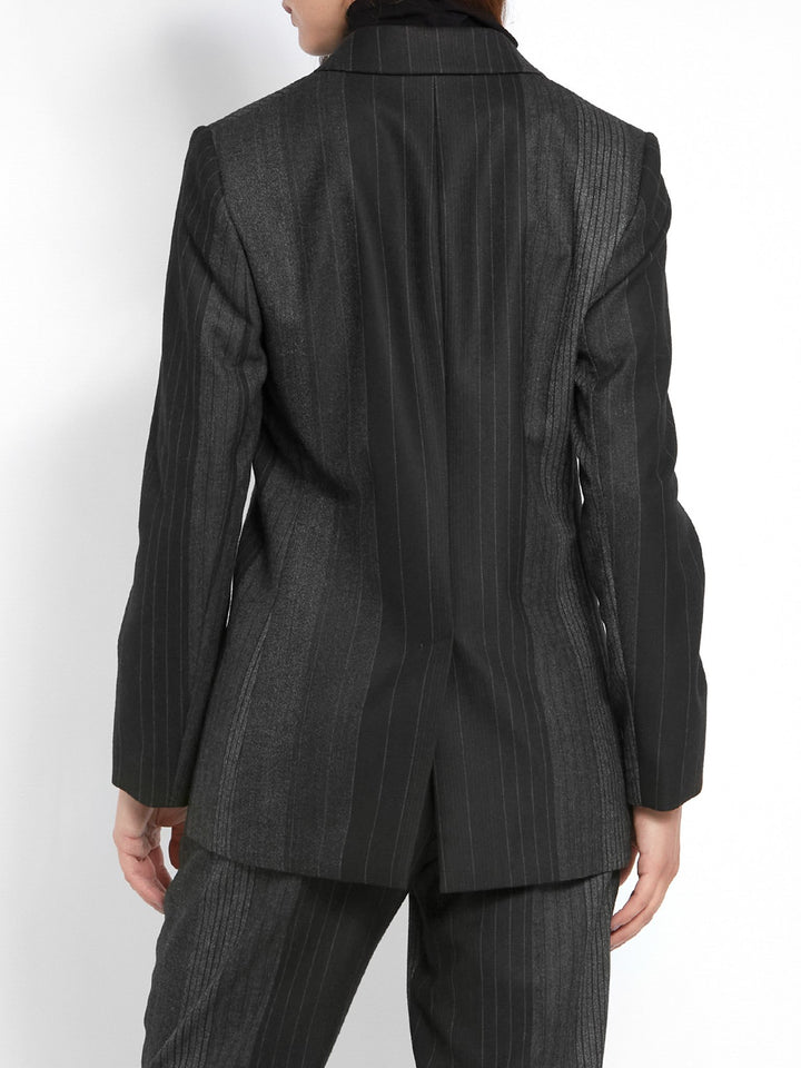 Think Diane Keaton in Manhattan. An elegant jacket fabricated in an androgynous random monotone stripe. A Classic Semi-Fitted silhouette with lapel collar, jeet pockets, lined & tailored with a one-button fastening. Helen proses to style with the co-ordinating Sophie pant & Cora polo-neck top.
