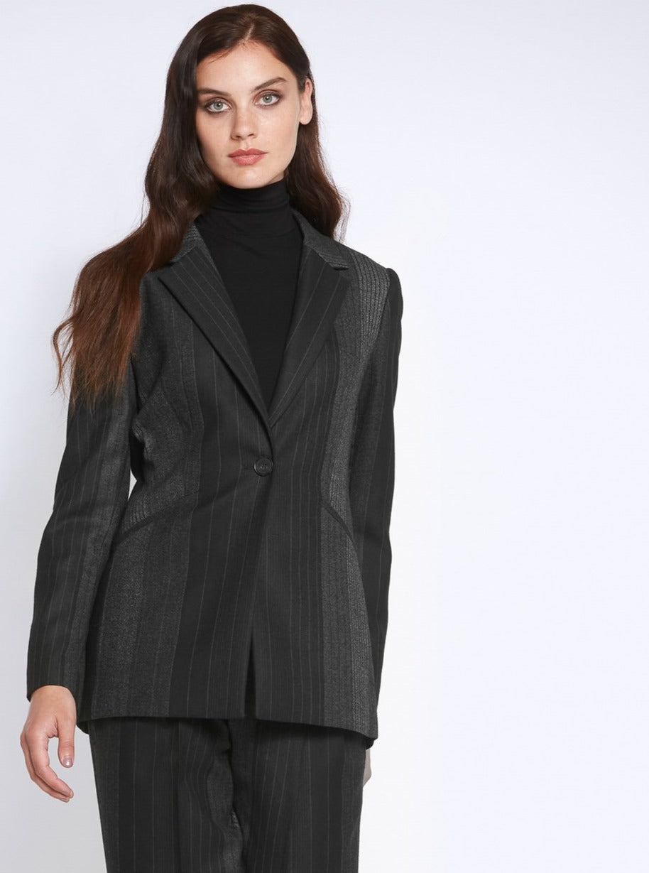 Think Diane Keaton in Manhattan. An elegant jacket fabricated in an androgynous random monotone stripe. A Classic Semi-Fitted silhouette with lapel collar, jeet pockets, lined & tailored with a one-button fastening. Helen proses to style with the co-ordinating Sophie pant & Cora polo-neck top.