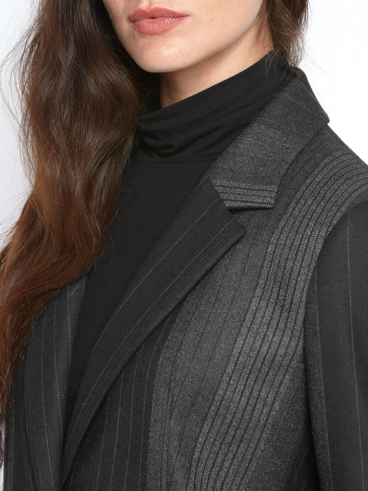 Think Diane Keaton in Manhattan. An elegant jacket fabricated in an androgynous random monotone stripe. A Classic Semi-Fitted silhouette with lapel collar, jeet pockets, lined & tailored with a one-button fastening. Helen proses to style with the co-ordinating Sophie pant & Cora polo-neck top.